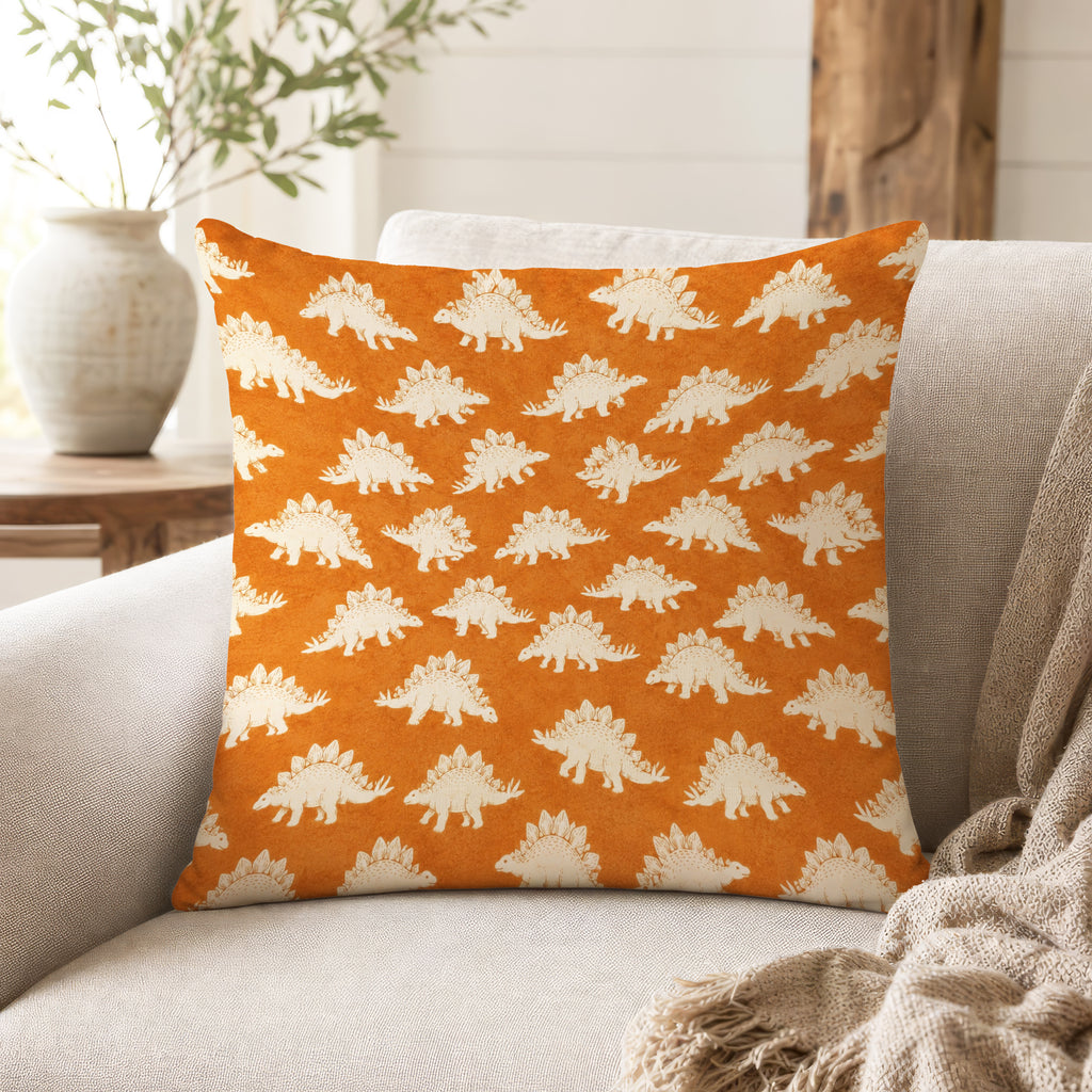 Stegosaurus Parade – Burnt Orange Dinosaur Pillow