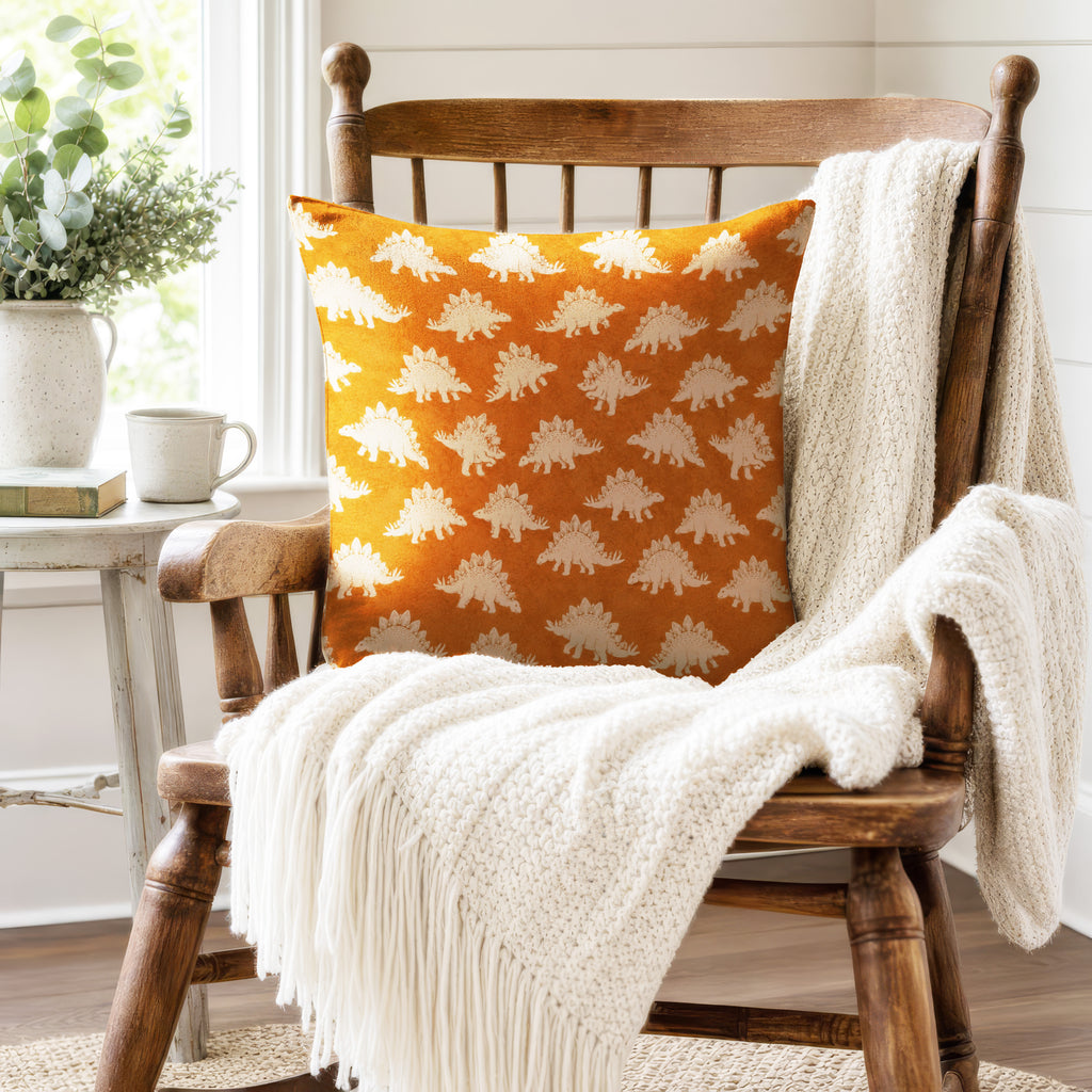 Stegosaurus Parade – Burnt Orange Dinosaur Pillow